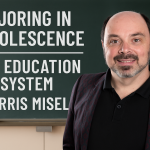 Morris Misel standing in front of a chalkboard backdrop with the words “Majoring in Obsolescence?” written in classroom-style font, challenging traditional education.